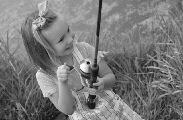 This girl learned about the fun of fishing with her foster family at the Sept. 12 event. (Daniel Griffith/ODWC)