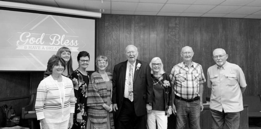 Above, Arbuary Ritter, center, is joined by his wife and faithful members of Randlett, Union Valley. The members pictured were children when Ritter started his pastorate at Union Valley in 1958.